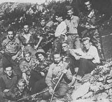 female partisan in a group of male partisans in the mountains